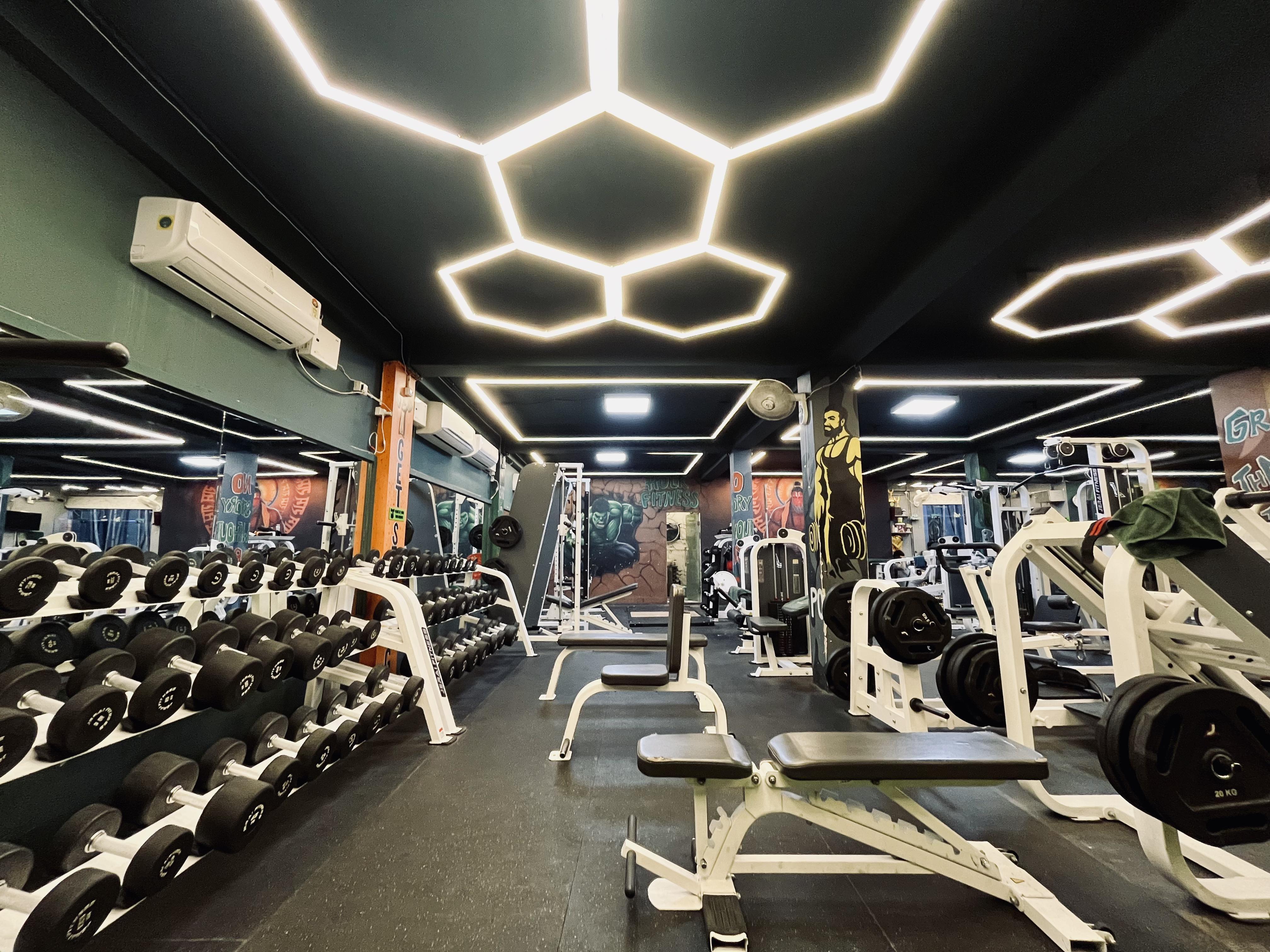 Hulk Fitness gym interior with premium JERAI equipment and hexagonal LED ceiling