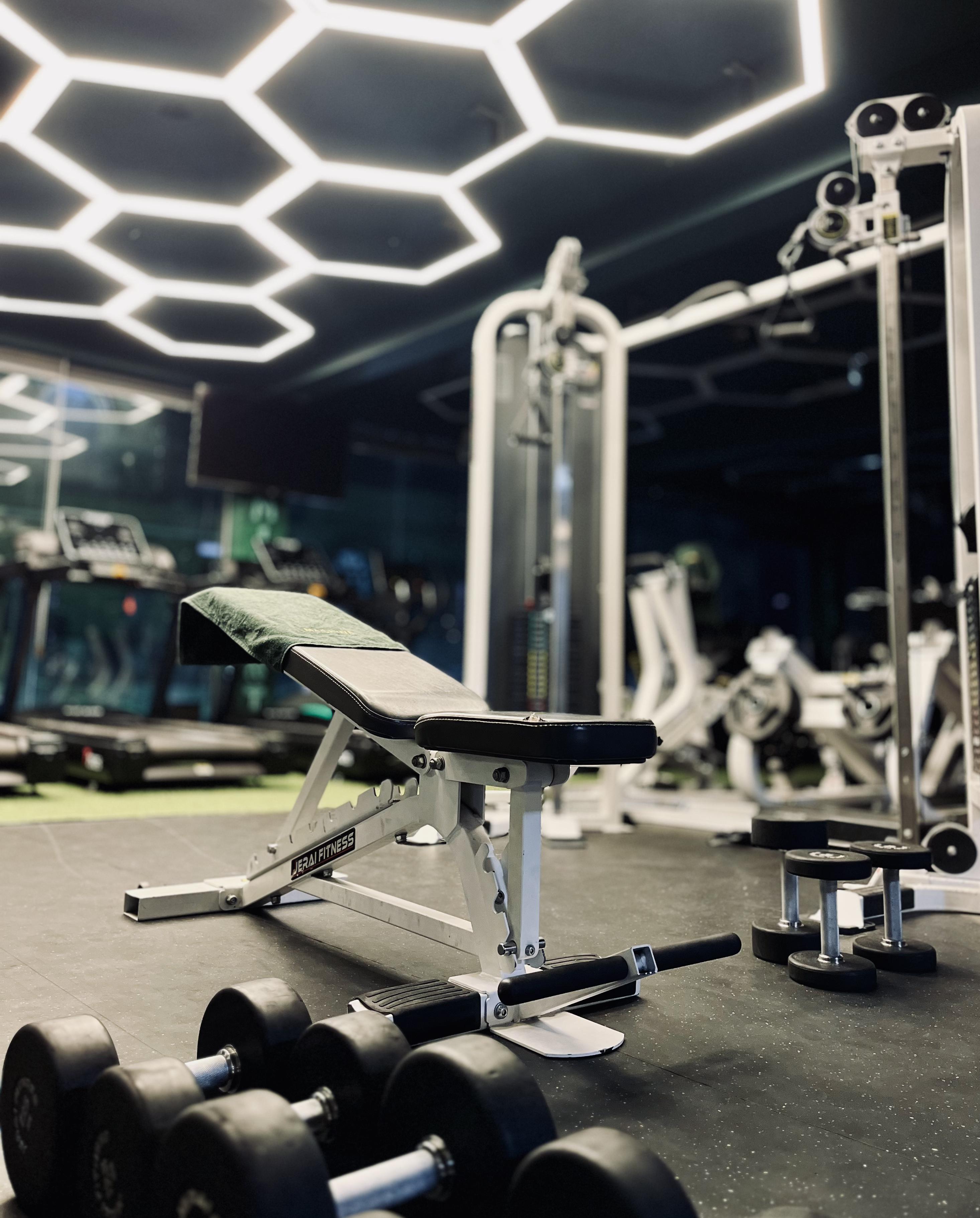 JERAI adjustable bench and dumbbells on gym floor